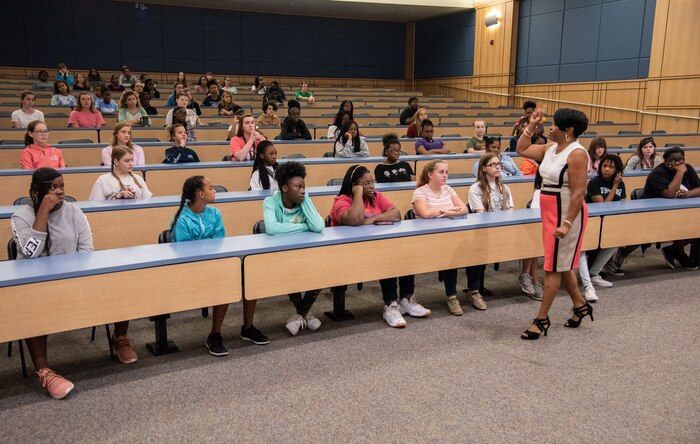 Shanda Johnson, Space and Naval Warfare Systems Center Atlantic Science, Technology, Engineering and Mathematics (STEM) outreach director, speaks to more than 100 attendees at the seventh Annual Girls Day Out event July 26, 2018, at Trident Technical College.