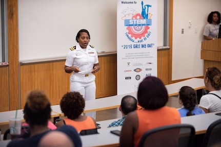 U.S. Navy Lt. Cdr. Crystal Bryant, Naval Health Clinic Charleston family nurse practitioner, gives closing remarks to more than 100 Girls Day Out attendees and their parents at College of Charleston as part of the seven annual Girls Day Out camp, hosted by SSC Atlantic in collaboration with Trident Technical College via Cyber Secure, College of Charleston, Bosch, Naval Health Clinic Charleston, Paul Mitchell the School Charleston, and NUCOR Steel Berkeley.