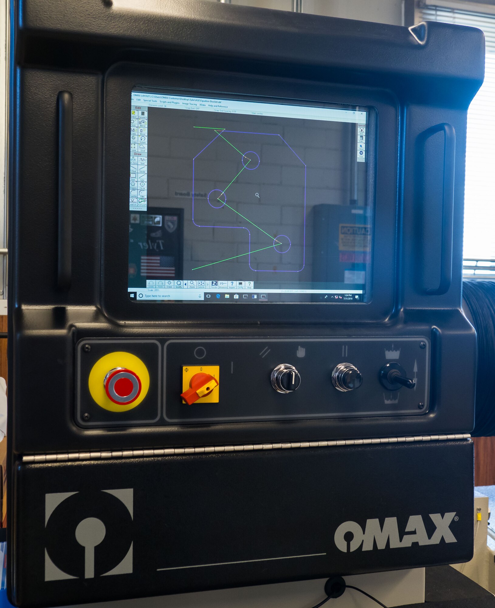 The display on the machine shows where the cuts will be made and data about the materials used. (Air Force Photo/Paul Zadach)