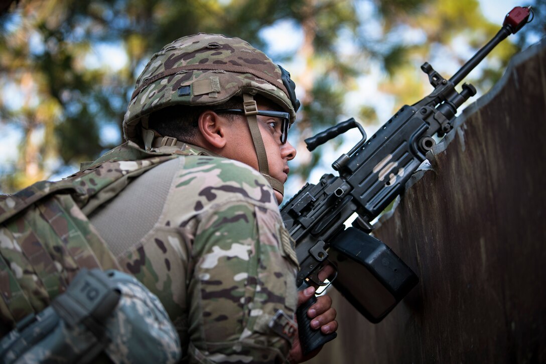 Airman 1st Class Samuel Cortes, 822d Base Defense Squadron (BDS) fireteam member, guards a simulated forward operating base during a full mission profile assessment, July 24, 2018, at Moody Air Force Base, Ga. The ‘Safeside’ defenders evaluated their base defense tactics and procedures while performing patrols, tactical combat casualty care and countering improvised explosive devices for a mission readiness exercise. After successfully completing these events, the defenders are eligible to earn their Global Response Force status, which certifies the unit to deploy worldwide. (U.S. Air Force photo by Airman Taryn Butler)
