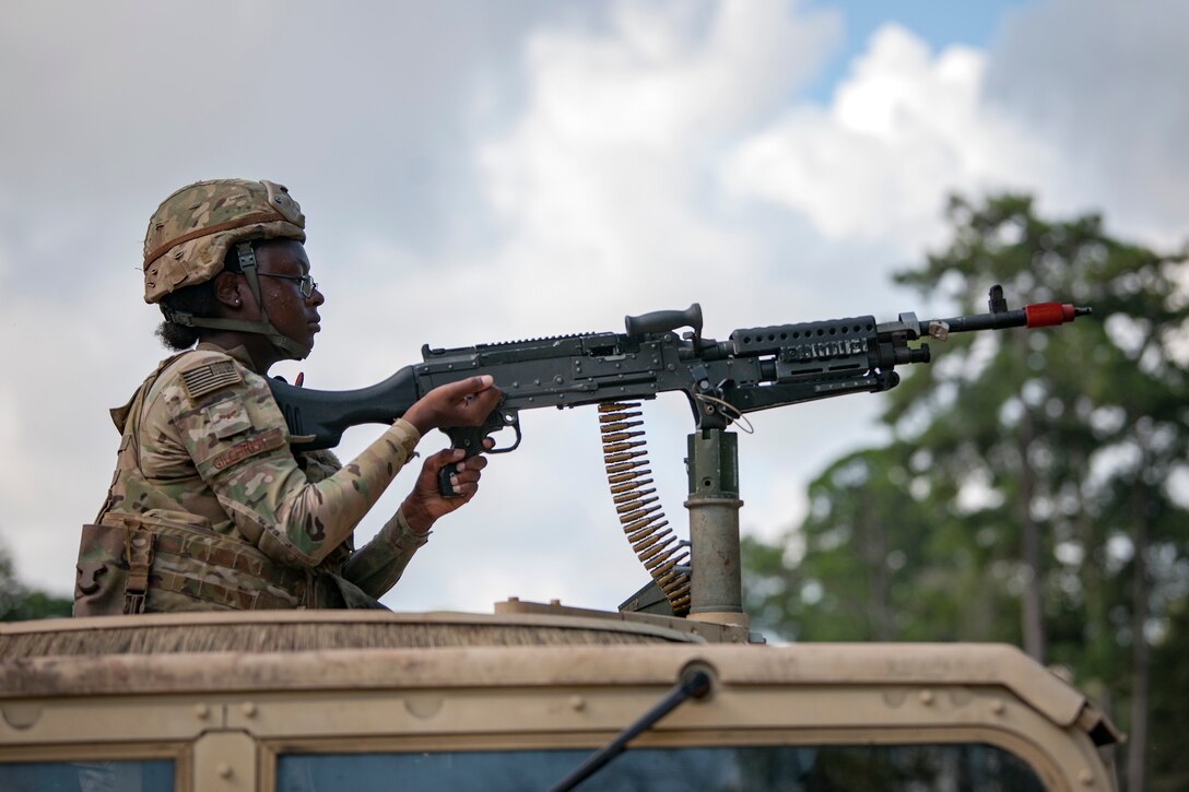 Airman 1st Class Zaire Gilchrist, 822d Base Defense Squadron (BDS) fireteam member, fires an M240B machine gun during a full mission profile assessment, July 24, 2018, at Moody Air Force Base, Ga. The ‘Safeside’ defenders evaluated their base defense tactics and procedures while performing patrols, tactical combat casualty care and countering improvised explosive devices for a mission readiness exercise. After successfully completing these events, the defenders are eligible to earn their Global Response Force status, which certifies the unit to deploy worldwide. (U.S. Air Force photo by Airman Taryn Butler)