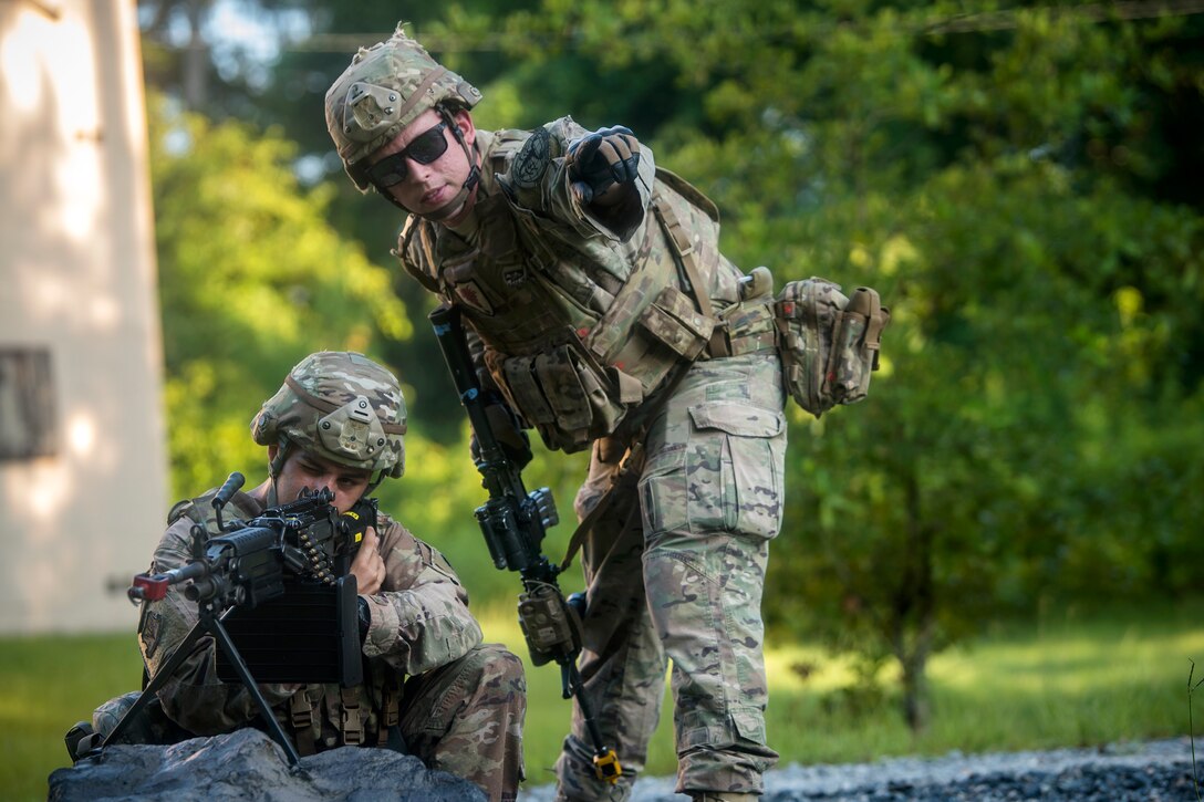 Staff Sgt. Joseph Lavenski, right, 822d Base Defense Squadron fireteam leader, instructs Airman 1st Class Luis Perez, 822d BDS fireteam member, July 25, 2018, at Moody Air Force Base, Ga. The ‘Safeside’ defenders evaluated their base defense tactics and procedures while performing patrols, tactical combat casualty care and countering improvised explosive devices for a mission readiness exercise. After successfully completing these events, the defenders are eligible to earn their Global Response Force status, which certifies the unit to deploy worldwide. (U.S. Air Force photo by Airman 1st Class Eugene Oliver)