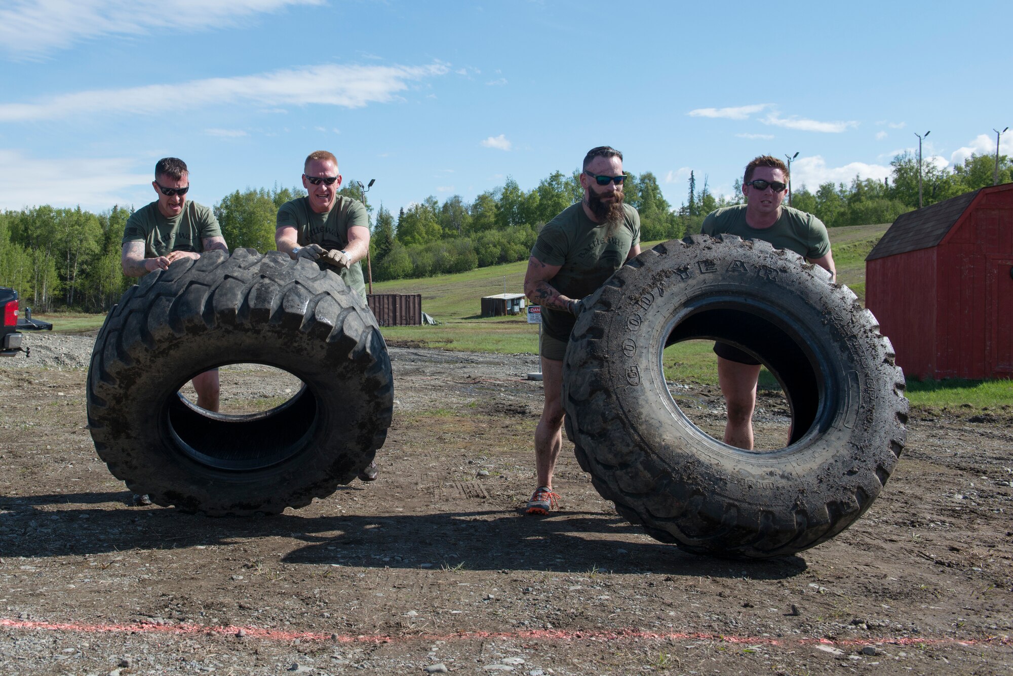 Airmen, Soldiers, and civilians participate in the Dirty Dozen challenge held during Resiliency Day at Joint Base Elmendorf-Richardson, Alaska, May 25, 2017. Dirty Dozen is a series of 12 challenges, each testing the team physically and intellectually.