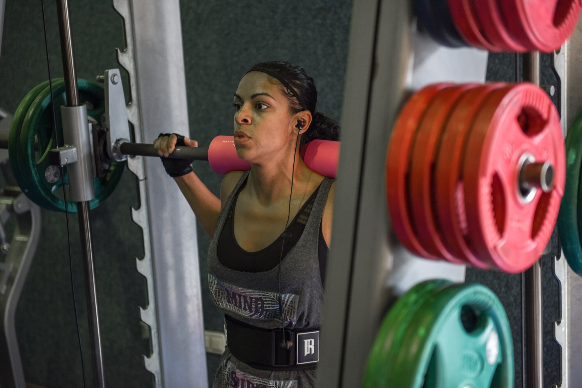 U.S. Air Force Master Sgt. Diana Valdez does part of her leg workout on the smith machine at Incirlik Air Base, Turkey, 2018