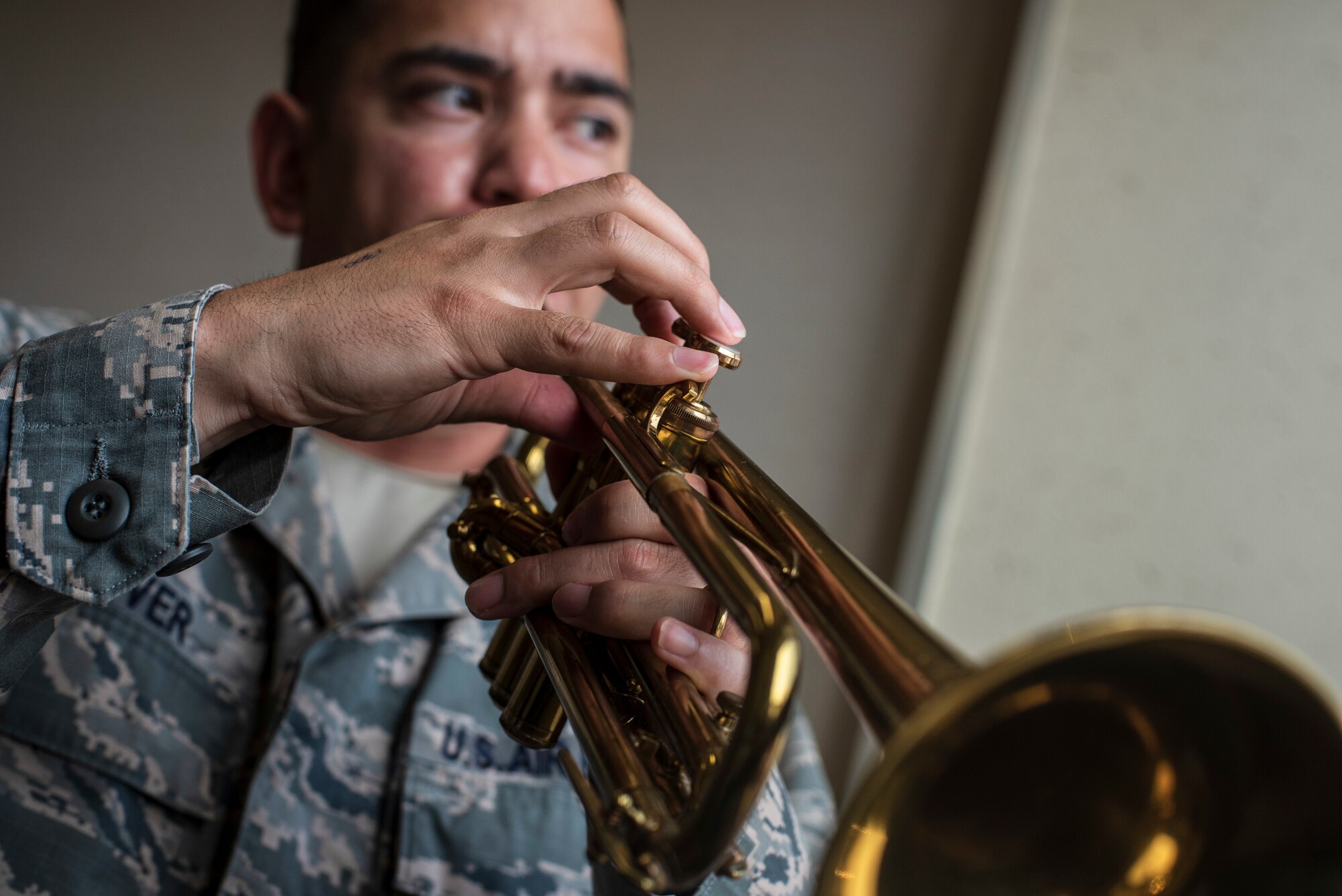 U.S. Air Force Capt. Charles Glover, the 35th Maintenance Squadron Operations officer, plays his trumpet in the Youth Center music room at Misawa Air Base, Japan, July 25, 2018. Glover is passionate about jazz music and plays in his spare time in order to relax. (U.S. Air Force photo by Airman 1st Class Collette Brooks)