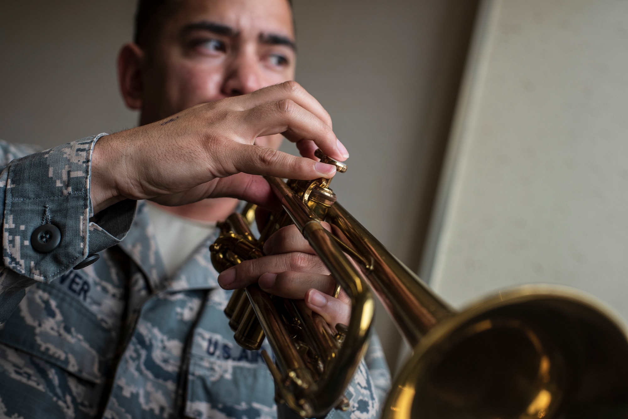 U.S. Air Force Capt. Charles Glover, the 35th Maintenance Squadron Operations officer, plays his trumpet in the Youth Center music room at Misawa Air Base, Japan, July 25, 2018. Glover is passionate about jazz music and plays in his spare time in order to relax. (U.S. Air Force photo by Airman 1st Class Collette Brooks)