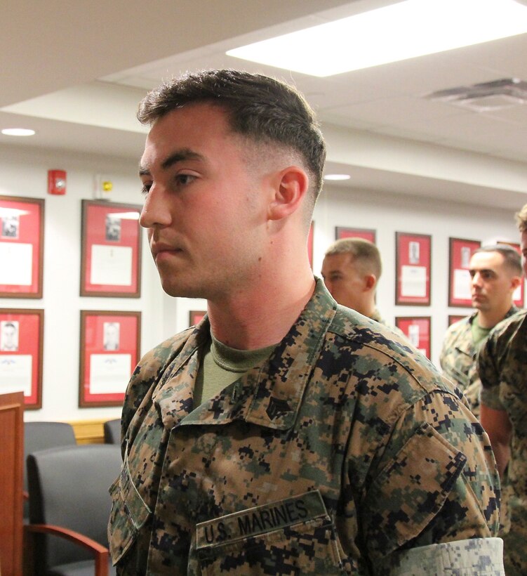 USAG CAMP HUMPHREYS, Korea - Sgt. Barry Smith, U.S. Marine Corps Forces Korea G6 Help Desk, and his peers listen to Smith’s leadership speak about his contributions to the command at his promotion ceremony here, August 1. Smith promoted to the rank of sergeant, considered as a major milestone in a Marine’s career and the backbone of the service. (U.S. Marine Corps photo by Sgt. Nathaniel Hanscom/Released)