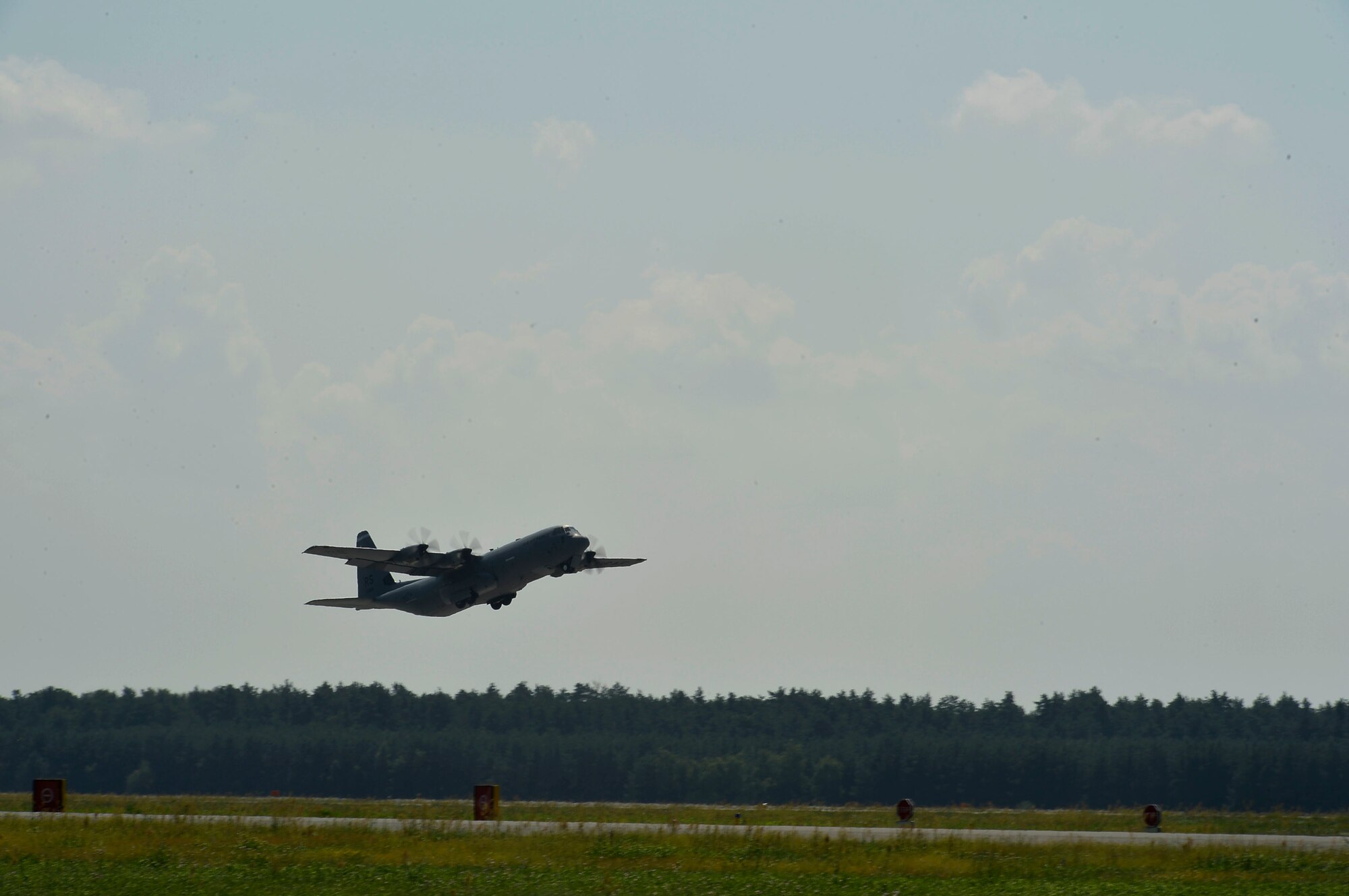 A U.S. Air Force C-130J Super Hercules assigned to the 86th Airlift Wing takes off from Powidz Air Base, Poland, July 31, 2018. Approximately 100 Airmen and three aircraft arrived in Poland to conduct bilateral training exercises with the Polish Air Force. (U.S. Air Force photo by Senior Airman Joshua Magbanua)