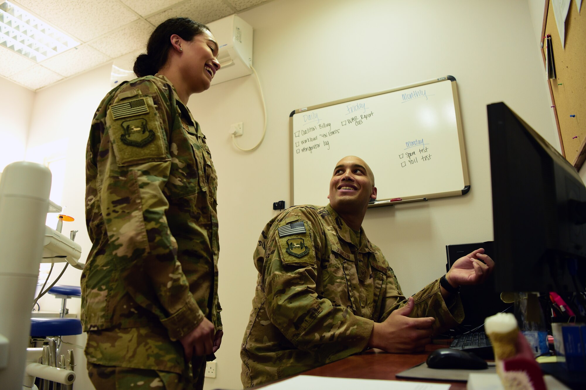 Staff Sgt. Gregory Johnson, 386th Expeditionary Medical Group dental clinic non-commissioned officer in charge, conducts a change-over brief with his sister, Staff Sgt. Torii Olivieri July 30, 2018, at an undisclosed location in Southwest Asia. During the change-over, Johnson provided his sister a base tour and reviewed instrument processing center functions, which ensures tools are safe for patient use. (U.S. Air Force photo by Staff Sgt. Christopher Stoltz)
