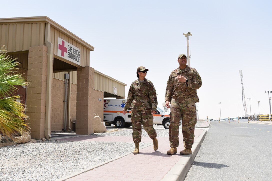 Staff Sgt. Gregory Johnson, 386th Expeditionary Medical Group dental clinic non-commissioned officer in charge, takes his sister, Staff Sgt. Torii Olivieri on a tour of ‘the Rock’ July 30, 2018, at an undisclosed location in Southwest Asia. Olivieri will be replacing Johnson’s position and is deployed from the 78th Aeromedical Medical-Dental Squadron at Robins Air Force Base, Georgia. (U.S. Air Force photo by Staff Sgt. Christopher Stoltz)