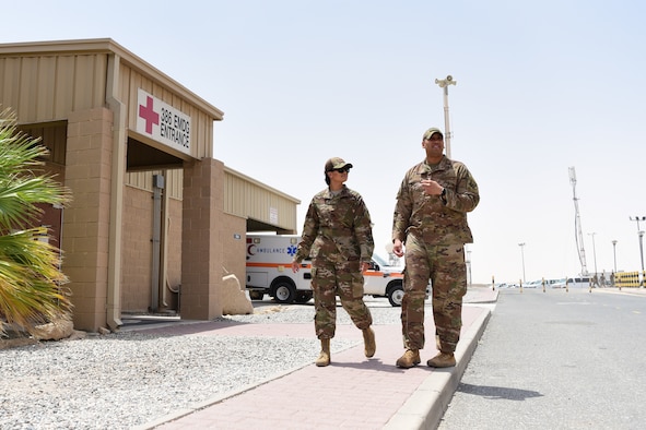 Staff Sgt. Gregory Johnson, 386th Expeditionary Medical Group dental clinic non-commissioned officer in charge, takes his sister, Staff Sgt. Torii Olivieri on a tour of ‘the Rock’ July 30, 2018, at an undisclosed location in Southwest Asia. Olivieri will be replacing Johnson’s position and is deployed from the 78th Aeromedical Medical-Dental Squadron at Robins Air Force Base, Georgia. (U.S. Air Force photo by Staff Sgt. Christopher Stoltz)