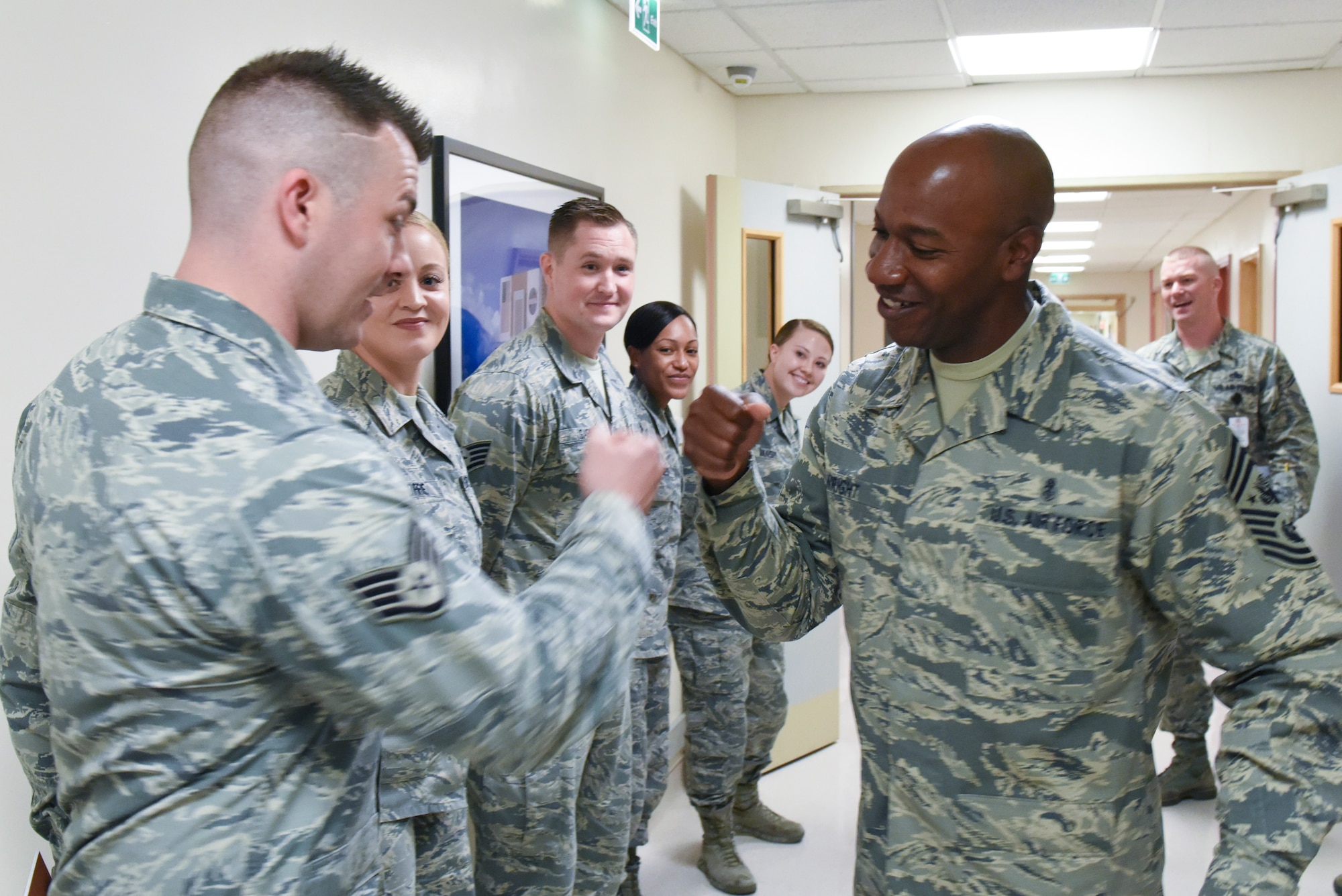Chief Master Sgt. of the Air Force Kaleth O. Wright greets Airmen assigned to the 48th Medical Group during an immersion tour of Royal Air Force Lakenheath, England, Aug. 1, 2018. During his visit, Wright met with 48th Fighter Wing Airmen to answer questions and see how they take care of the mission. (U.S. Air Force photo by Airman 1st Class Christopher Sparks)