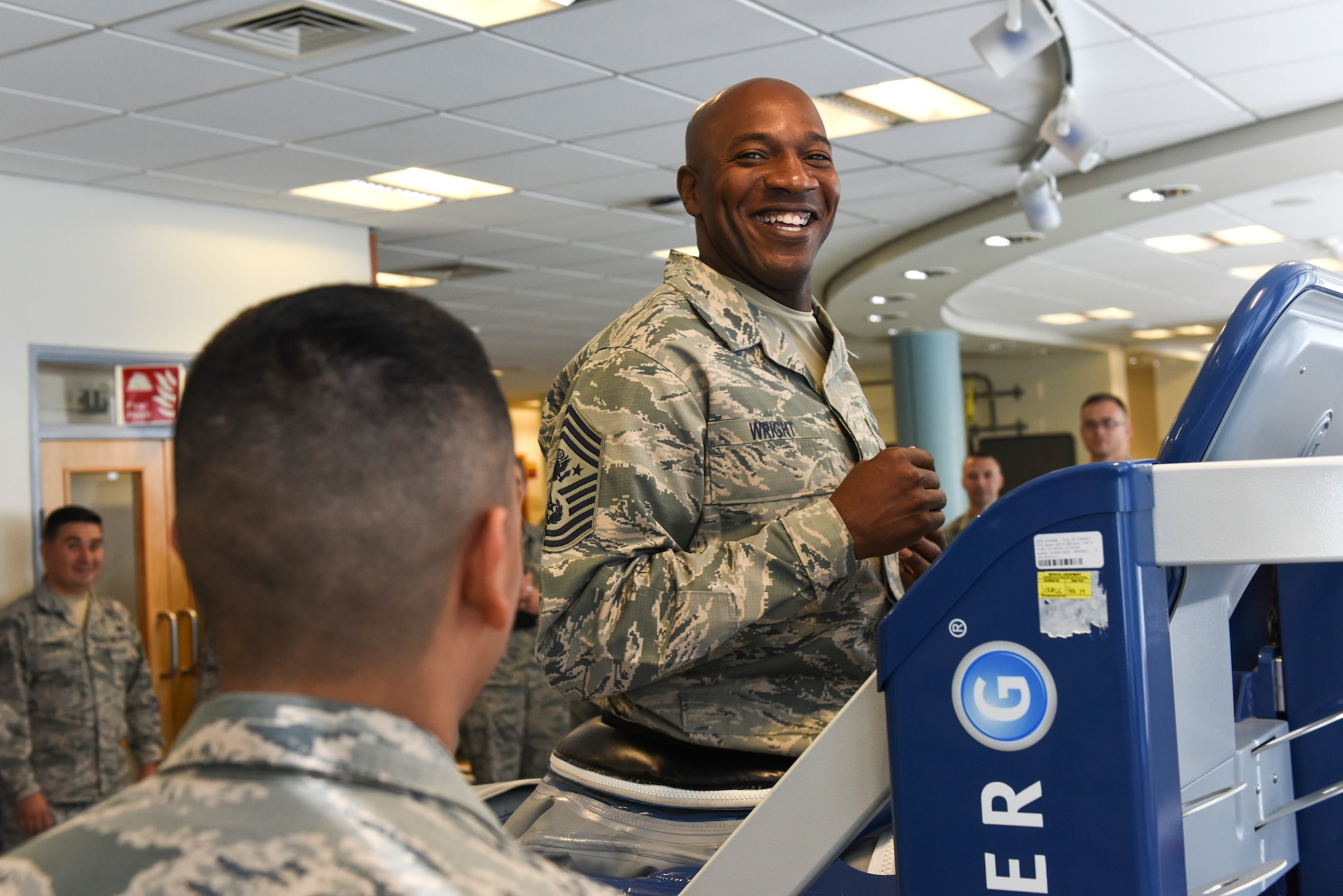 Chief Master Sgt. of the Air Force Kaleth O. Wright runs on a weightless treadmill at the 48th Medical Group during an immersion tour, Aug. 1, 2018 at Royal Air Force Lakenheath, England. The purpose of his visit was to meet the men and women of the 48th Fighter Wing and learn about how they take care of the mission. (U.S. Air Force photo/Airman 1st Class Christopher S. Sparks)