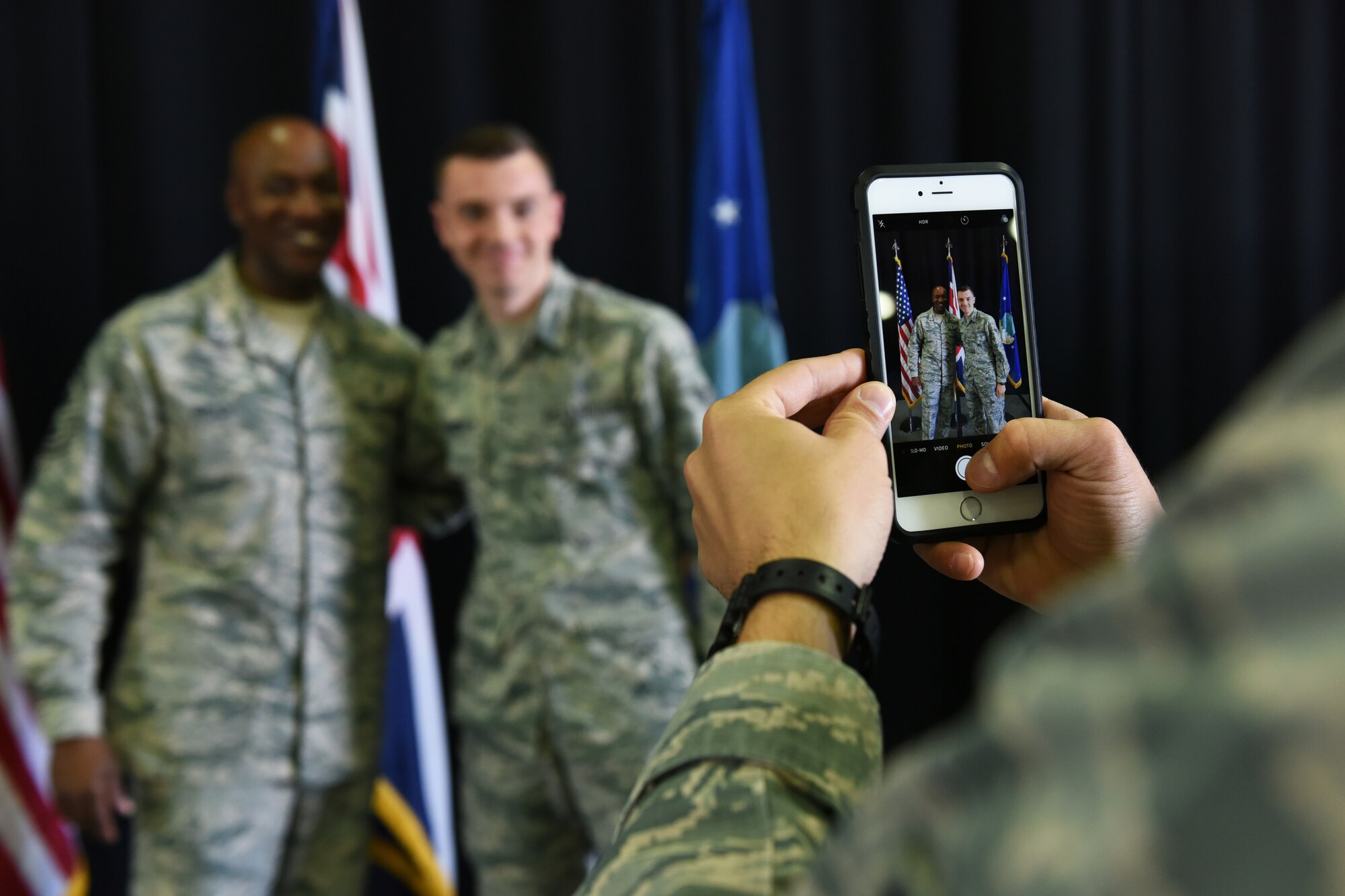 Chief Master Sgt. of the Air Force, Kaleth O. Wright, poses for a photo with a Liberty Wing Airman, Aug. 1, 2018 at Royal Air Force Lakenheath, England. The purpose of his visit was to meet the men and women of the 48th Fighter Wing and learn about how they take care of the mission. (U.S. Air Force photo/Airman 1st Class Christopher S. Sparks)