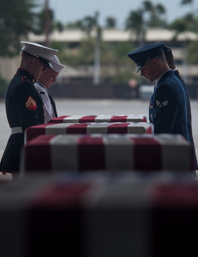 An honor guard detail of Indo-Pacific Command personnel conducts an honorable carry ceremony at Joint Base Pearl Harbor-Hickam, Hawaii, Aug. 1, 2018.