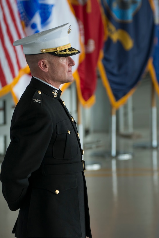 Marine Corps Col. Michael Gann, Defense POW/MIA Accounting Agency Indo-Pacific Directorate director, stands at parade rest during an honorable carry ceremony at Joint Base Pearl Harbor-Hickam, Hawaii, Aug. 1, 2018.