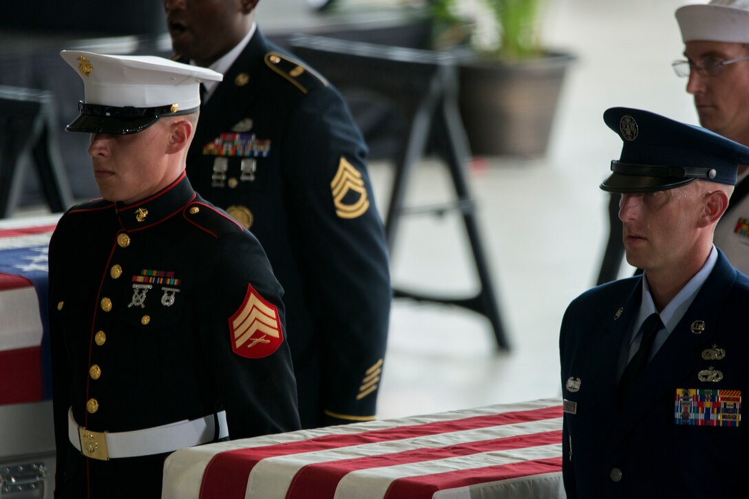 An honor guard detail of Indo-Pacific Command personnel conducts an honorable carry ceremony at Joint Base Pearl Harbor-Hickam, Hawaii, Aug. 1, 2018.