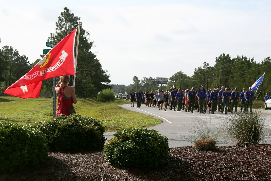 Marines, Sailors and local residents participate in the Marine Raider Memorial March in Sneads Ferry, N.C., July 27, 2018. The march spanned 900 miles from Mississippi to North Carolina, ending with a ceremony aboard Marine Corps Base Camp Lejeune. (U.S. Marine Corps photo by Sgt. Janessa K. Pon