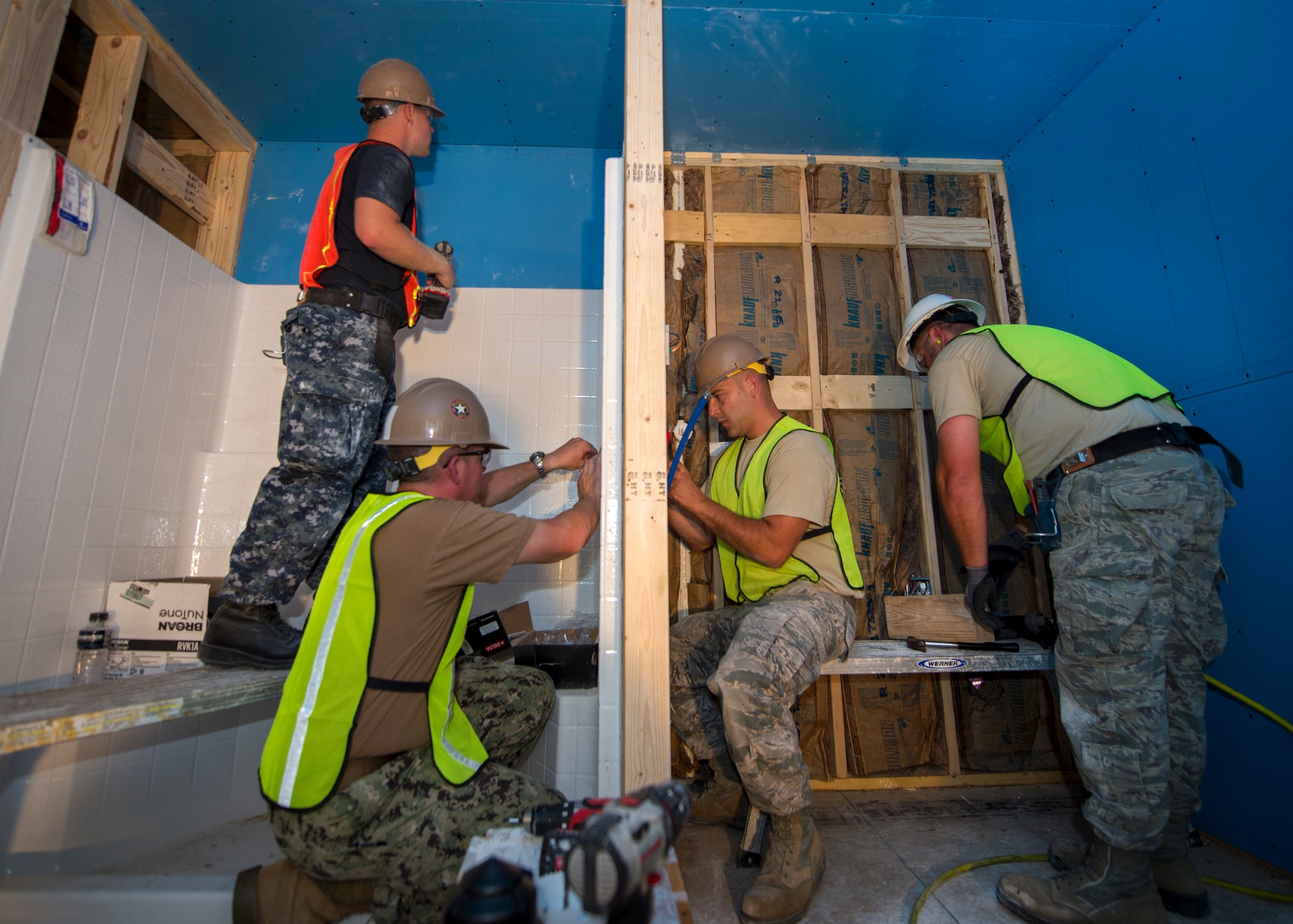 U.S. Air Force Airmen from the 133rd and 148th Civil Engineer Squadrons work alongside U.S. Navy Seabees from the Naval Mobile Construction Battalion 22 to construct transportable modular homes in Gallup, N.M., July 24, 2018.