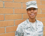 Staff Sgt. Psalmbrea Noel Doss, a personnel specialist with the 194th Force Support Squadron assigned to the Washington Air National Guard, poses for a photo July 18, 2018, at Camp Murray, Wash. Doss heard about the Air National Guard through her mother, who was also once a personnel specialist in the Air Force.