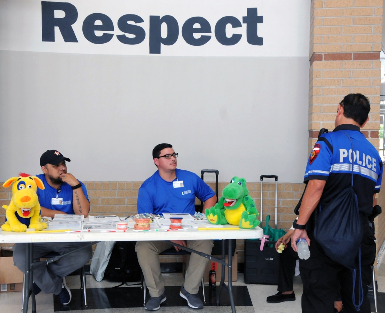 Texas A&M University students, Andrew Deases (left) and Juan Marives (middle), provide dental education for the community at Betty Harwell Middle School in Edinburg, Texas. Deases and Marives are two of several students who volunteered to assist 50 U.S. Army Reserve Soldiers assigned to the 7235th Medical Support Unit out of Orlando, Texas, worked in partnership with the Texas A&M Colonias program June 16-27 to provide medical care to Hidalgo County's underserved colonia population. Services provided by military personnel are done through the Department of Defense's Innovative Readiness Training, a civil-military program that builds mutually beneficial partnerships between U.S. communities and the DOD. The missions selected meet training & readiness requirements for Army Reserve service members while integrating them as a joint and whole-of-society team to serve our American citizens.