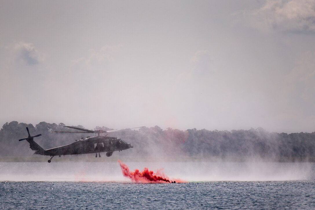 An MH-60S Knighthawk helicopter assigned to Helicopter Sea Combat Squadron 26 approaches a simulated casualty during a Search and Rescue (SAR) exercise conducted in the Beaufort River, S.C. July 27. Marine Corps Air Station Beaufort tenant units worked side by side with the U.S. Navy, Naval Hospital Beaufort, Savannah Coast Guard and local first responders to conduct the exercise. The training was the first SAR exercise involving F-35B Lightning II pilots. It not only increased mission readiness for each unit involved, but also increased interoperability between military and civilian first responders. (U.S. Marine Corps photo by Sgt. Brittney Vella)