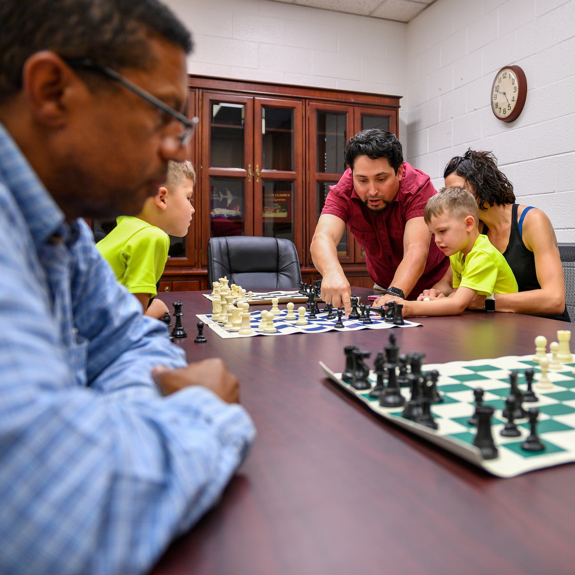 Marc Garcia provides instruction to players during a chess club meeting at Hill Air Force Base, Utah, July 26, 2018. Hosted by the Gerrity Memorial Library, the club weclomes players of all ages and skill levels. (U.S. Air Force photo by R. Nial Bradshaw)