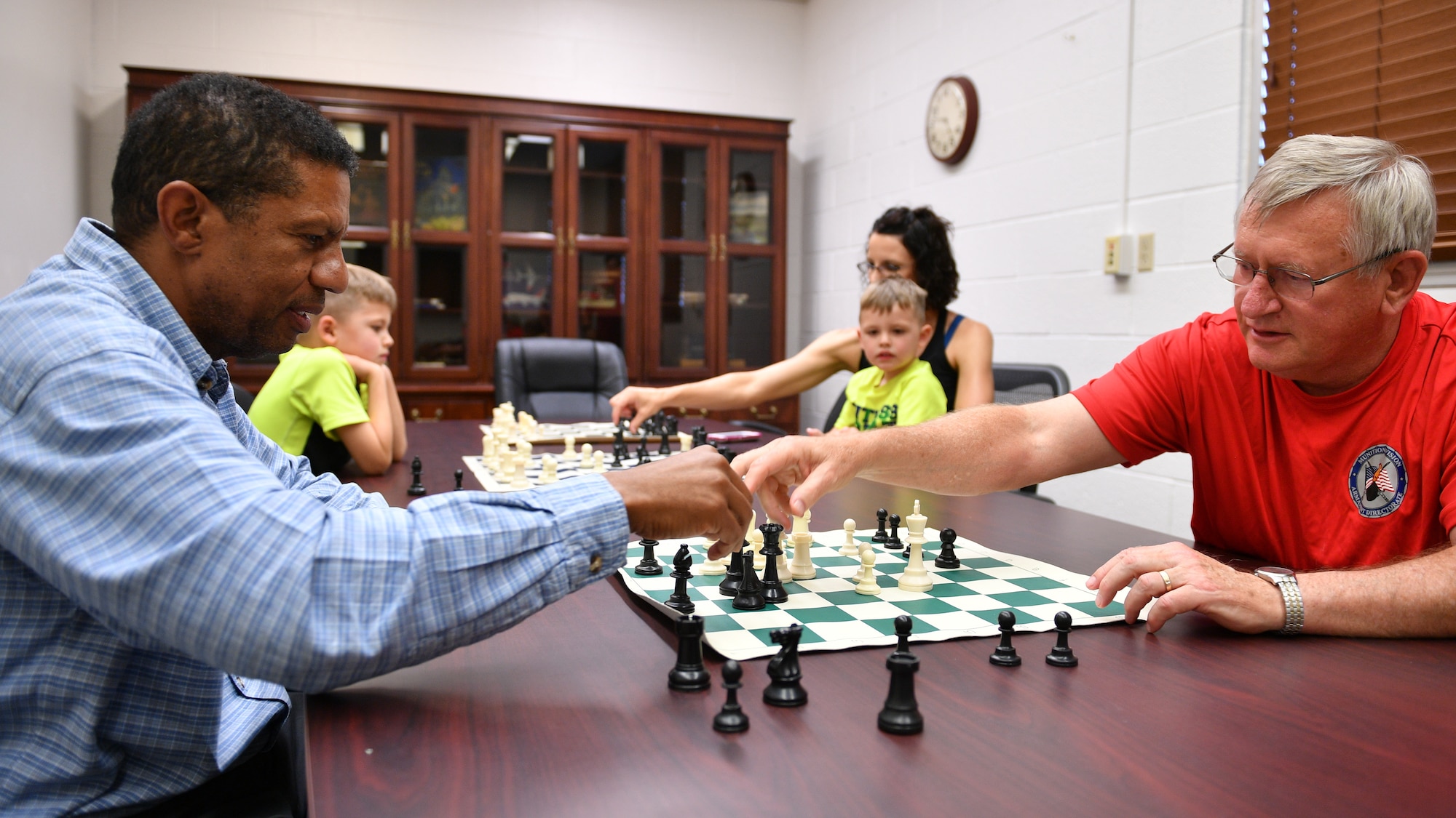 Roy Cole, left, and Neal Booher play a match during a 75th Support Squadron Chess Club meeting at Hill Air Force Base, Utah, July 26, 2018. The club is open to players of all ages and skill levels. (U.S. Air Force photo by R. Nial Bradshaw)