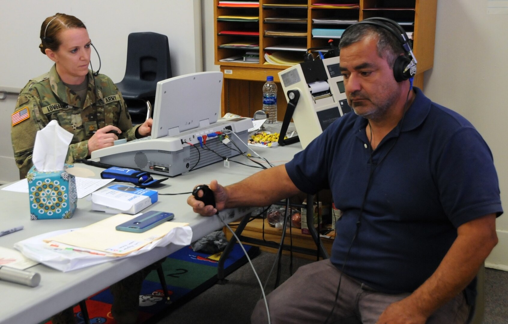 Maj. Sheri Loveland, an Army Reserve audiologist assigned to 7451st Medical Backfill Battalion, based out of Joint Base Lewis-McChord, Washington, tests a patient's hearing during his audio screening at Escontrias Early Childhood Center in Socorro, Texas. Loveland is one of approximately 50 U.S. Army Reserve and U.S. Army Soldiers who are working in partnership with the Texas A&M Colonias program to provide medical care to El Paso County's underserved colonias population. Services provided by military personnel are done through the Department of Defense's Innovative Readiness Training, a civil-military program that builds mutually beneficial partnerships between U.S. communities and the DOD. The missions selected meet training & readiness requirements for Army Reserve service members while integrating them as a joint and whole-of-society team to serve our American citizens.