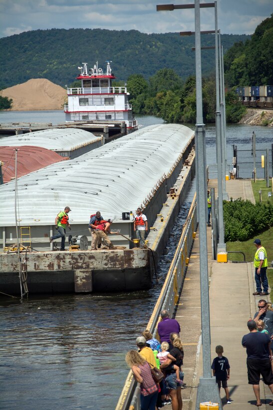 people watch as tow locks through