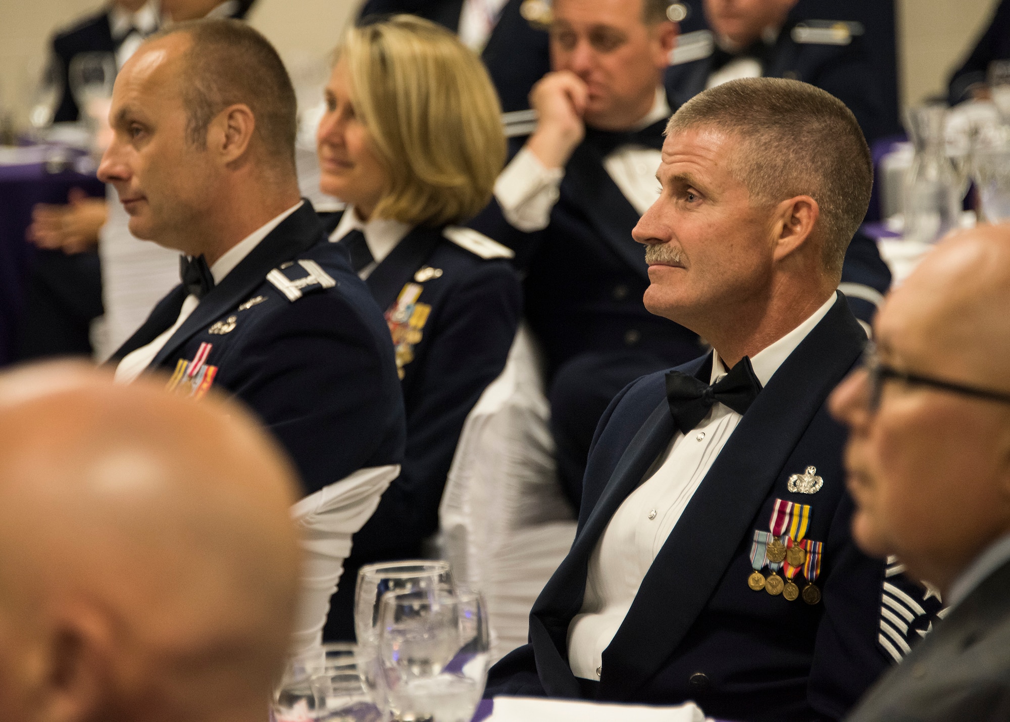 Dignitaries listen to guest speakers during the wing's inaugural Senior Non-commissioned Officer Induction Ceremony, held at Ebbing Air National Guard Base, Ark., June 2, 2018. The wing celebrated the accomplishments of its newest senior NCOs during the evening's event. (U.S. Air National Guard photo by Tech. Sgt. John E. Hillier)