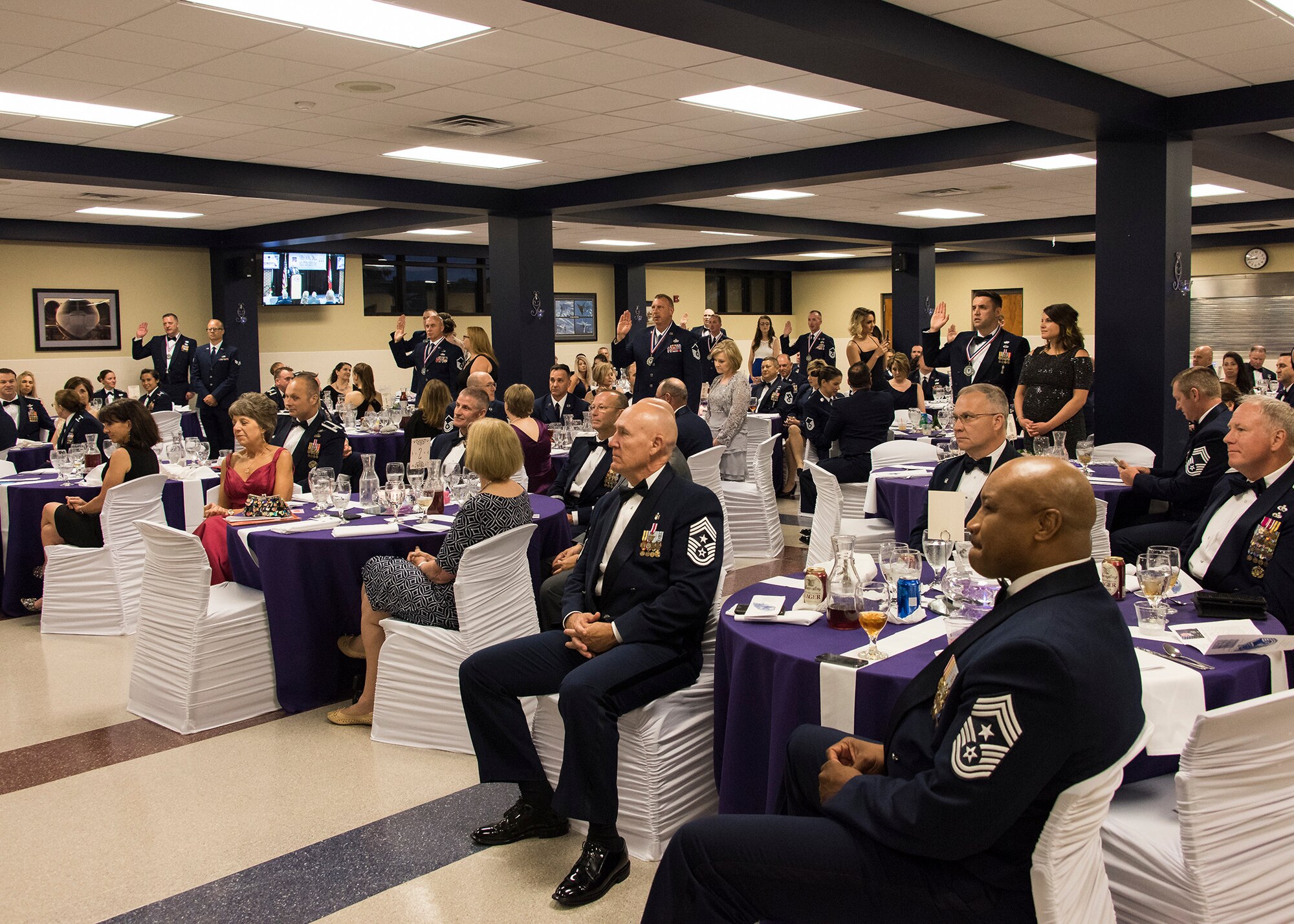 Newly-inducted senior non-commissioned officers take the Senior NCO Oath during the wing's inaugural Senior Non-commissioned Officer Induction Ceremony, held at Ebbing Air National Guard Base, Ark., June 2, 2018. The wing celebrated the accomplishments of its newest senior NCOs during the evening's event. (U.S. Air National Guard photo by Tech. Sgt. John E. Hillier)