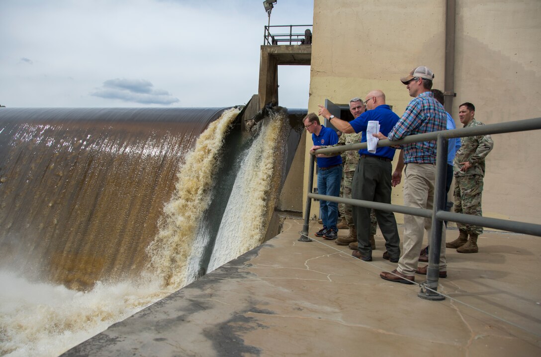 district staff visit a lock and dam site