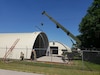 U.S. Army Reserve Soldiers from the 317th Engineer Company, out of Homewood, Ill., assemble metal sections on a 4,000 square foot Quonset hut at Joliet Training Area, in Elwood, Ill., as part of a Troop Support Project during their Annual Training, July 18.