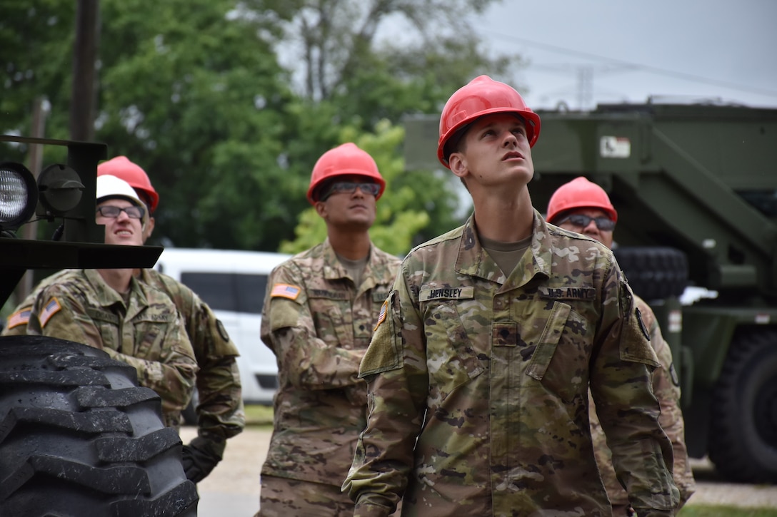 U.S. Army Reserve Soldiers from the 317th Engineer Company, out of Homewood, Ill., act as safety officers during the assembly of a 4,000 square foot Quonset hut at Joliet Training Area, in Elwood, Ill., July 20.