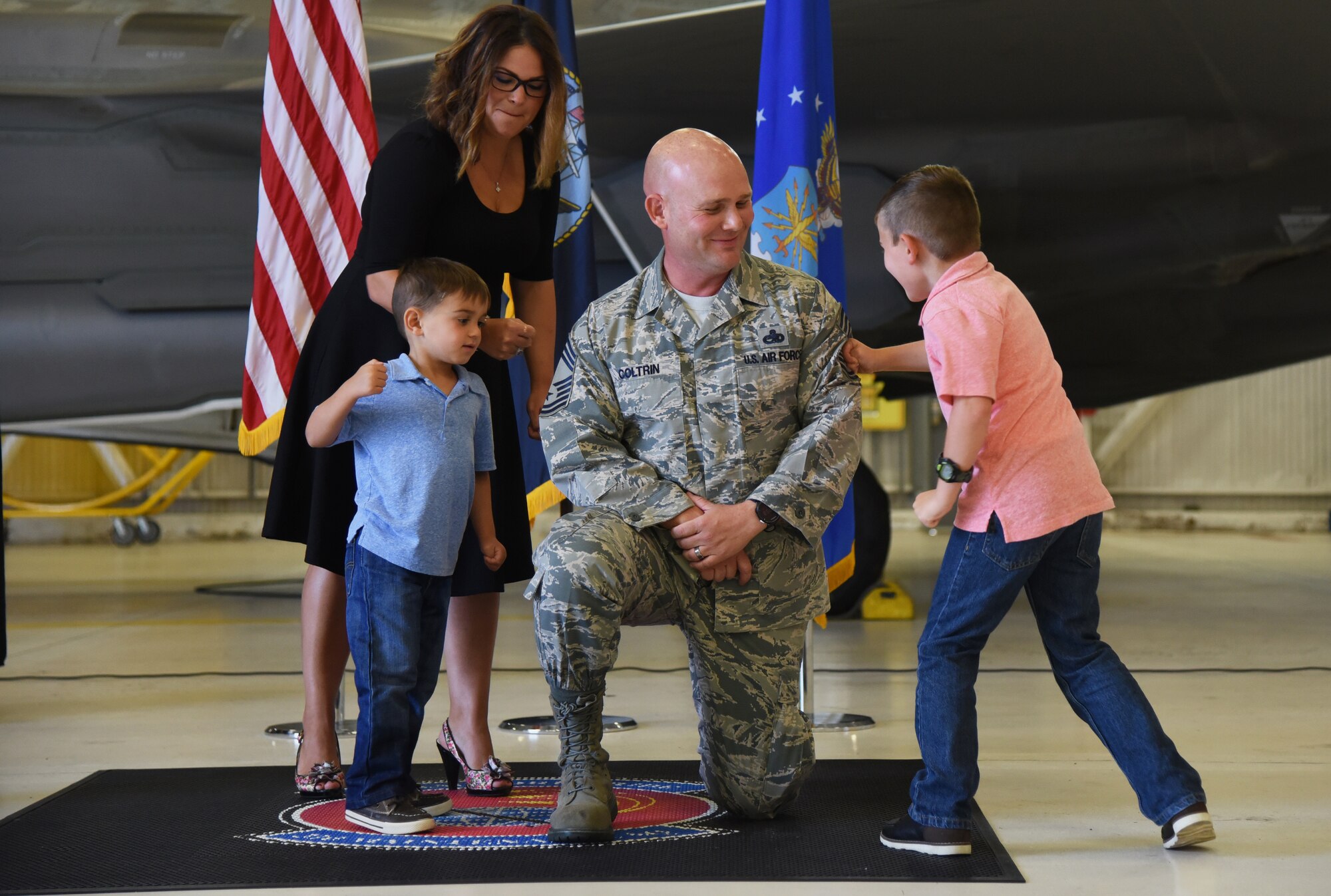 U.S. Navy Cmdr. Matthew Scott and Chief Master Sgt.(select) Matthew Coltrin, pose for a photo during the first enlisted frocking ceremony in Air Education and Training Command on Aug. 1, 2018 at Eglin AFB, Fla. A frocking ceremony allows a military member to pin on new rank prior to their promotion date. (U.S. Air Force photo by 1st Lt. Savannah Stephens)