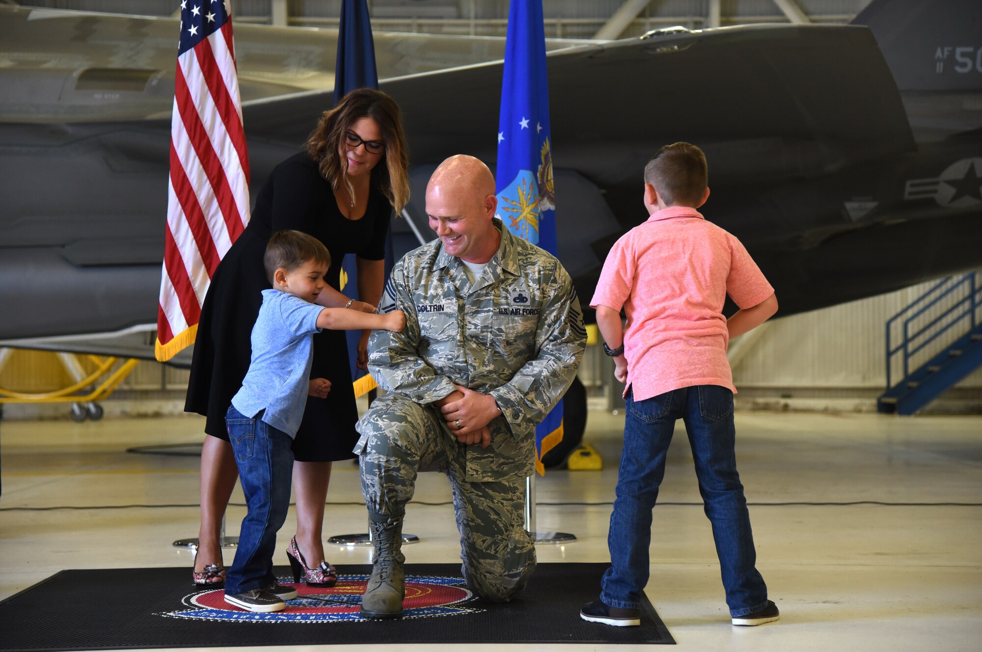 U.S. Navy Cmdr. Matthew Scott and Chief Master Sgt.(select) Matthew Coltrin, pose for a photo during the first enlisted frocking ceremony in Air Education and Training Command on Aug. 1, 2018 at Eglin AFB, Fla. A frocking ceremony allows a military member to pin on new rank prior to their promotion date. (U.S. Air Force photo by 1st Lt. Savannah Stephens)