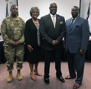 (From left)  Lt. Col. Aaron J. Braxton II, secretary, Fort Sam Houston Board of Trustees; Deborah E. Seabron, vice president; Dr. Gary Bates, FSHISD Superintendent; and Willie E White, Jr., President. The board chose Bates for his established instructional leadership, strength in collaboration, and focus on student learning and achievement.  He will begin his new role Aug. 6.