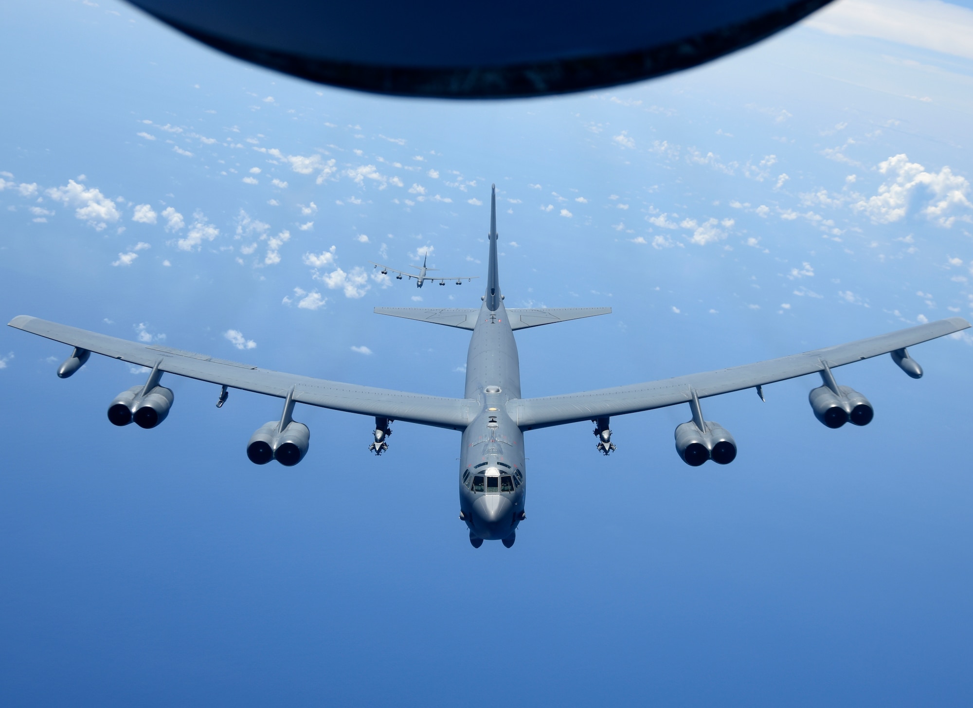 A U.S. Air Force B-52H Stratofortress bomber fly over the Pacific Ocean during a routine training mission Aug. 2, 2018. This mission was flown in support of U.S. Indo-Pacific Command’s Continuous Bomber Presence operations, which are a key component to improving combined and joint service interoperability. (U.S. Air Force photo by Airman 1st Class Gerald R. Willis)