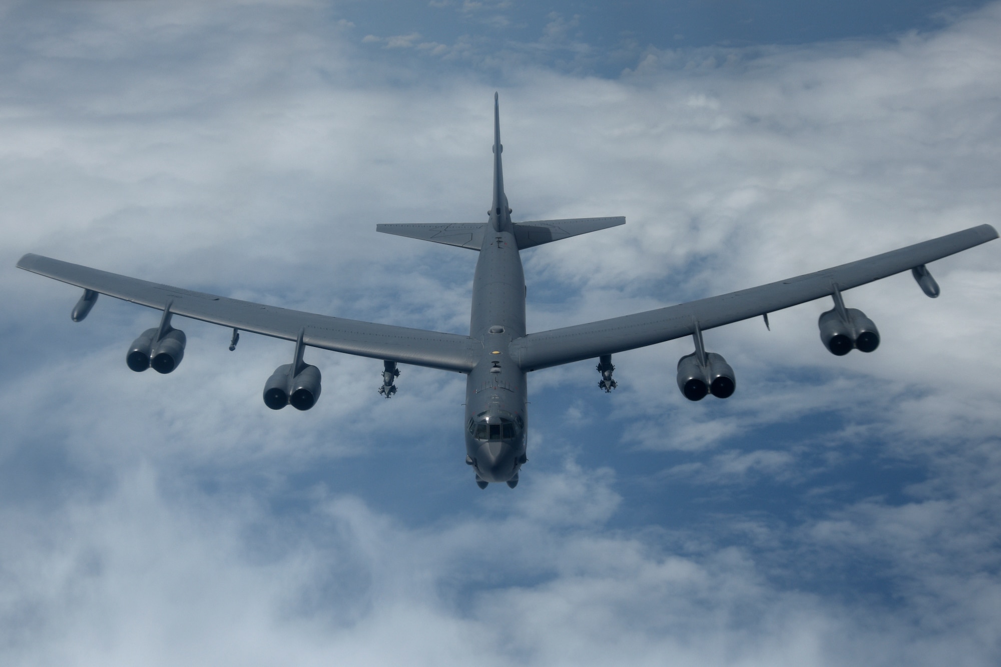 A U.S. Air Force B-52H Stratofortress bomber fly over the Pacific Ocean during a routine training mission Aug. 2, 2018. This mission was flown in support of U.S. Indo-Pacific Command’s Continuous Bomber Presence operations, which are a key component to improving combined and joint service interoperability. (U.S. Air Force photo by Airman 1st Class Gerald R. Willis)