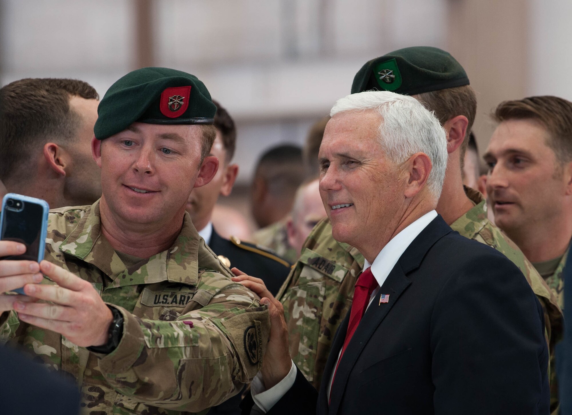 Vice President Michael R. Pence takes a photo with service members during a troop engagement on Joint Base Pearl Harbor-Hickam, August 1, 2018. Pence gave remarks at the honorable carry ceremony held at JPBH-H, honoring the memory of those lost during the Korean War and welcoming home the remains of the fallen. Following the ceremony, he met with approximately 100 local service members and their families from all military branches. Pence mingled amongst the troops shaking hands, taking photos and thanking them for their service. (U.S. Air Force photo by Hailey Haux)
