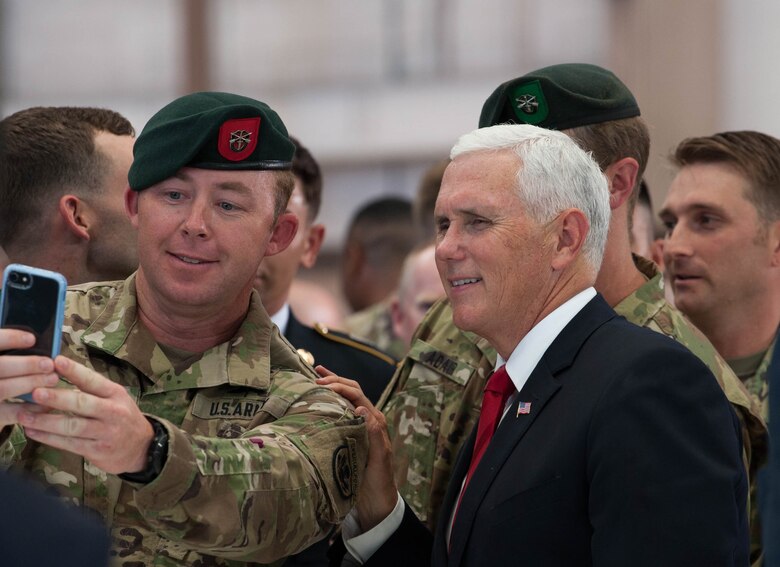 Vice President Michael R. Pence takes a photo with service members during a troop engagement on Joint Base Pearl Harbor-Hickam, August 1, 2018. Pence gave remarks at the honorable carry ceremony held at JPBH-H, honoring the memory of those lost during the Korean War and welcoming home the remains of the fallen. Following the ceremony, he met with approximately 100 local service members and their families from all military branches. Pence mingled amongst the troops shaking hands, taking photos and thanking them for their service. (U.S. Air Force photo by Hailey Haux)