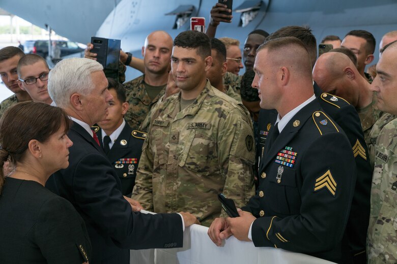 Vice President Michael R. Pence speaks with troops during a troop engagement on Joint Base Pearl Harbor on August 1, 2018. Pence gave remarks at the honorable carry ceremony held at JBPH-H, honoring the memory of those lost during the Korean War and welcoming home the remains of the fallen. Following the ceremony, he met with approximately 100 local service members and their families from all military branches. Pence mingled amongst the troops shaking hands, taking photos and thanking them for their service. (U.S. Air Force photo by Staff Sgt. Daniel Robles)