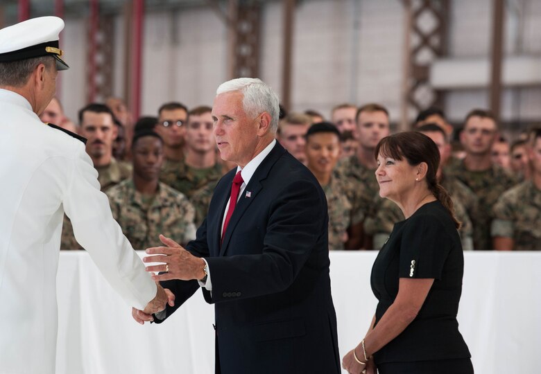 Vice President Michael R. Pence shakes hands with Adm. Philip S. Davidson, U.S. Indo-Pacific Command commander (USINDOPACOM) during a troop engagement on Joint Base Pearl Harbor-Hickam, August 1, 2018. Pence gave remarks at the honorable carry ceremony held at JPBH-H, honoring the memory of those lost during the Korean War and welcoming home the remains of the fallen. Following the ceremony, he met with approximately 100 local service members and their families from all military branches. Pence mingled amongst the troops shaking hands, taking photos and thanking them for their service. (U.S. Air Force photo by Hailey Haux)