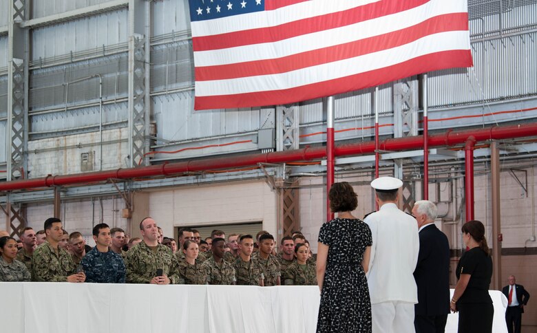 Vice President Michael R. Pence addresses a crowd of service members during a troop engagement on Joint Base Pearl Harbor-Hickam, August 1, 2018. Pence gave remarks at the honorable carry ceremony held at JPBH-H, honoring the memory of those lost during the Korean War and welcoming home the remains of the fallen. Following the ceremony, he met with approximately 100 local service members and their families from all military branches. Pence mingled amongst the troops shaking hands, taking photos and thanking them for their service. (U.S. Air Force photo by Hailey Haux)