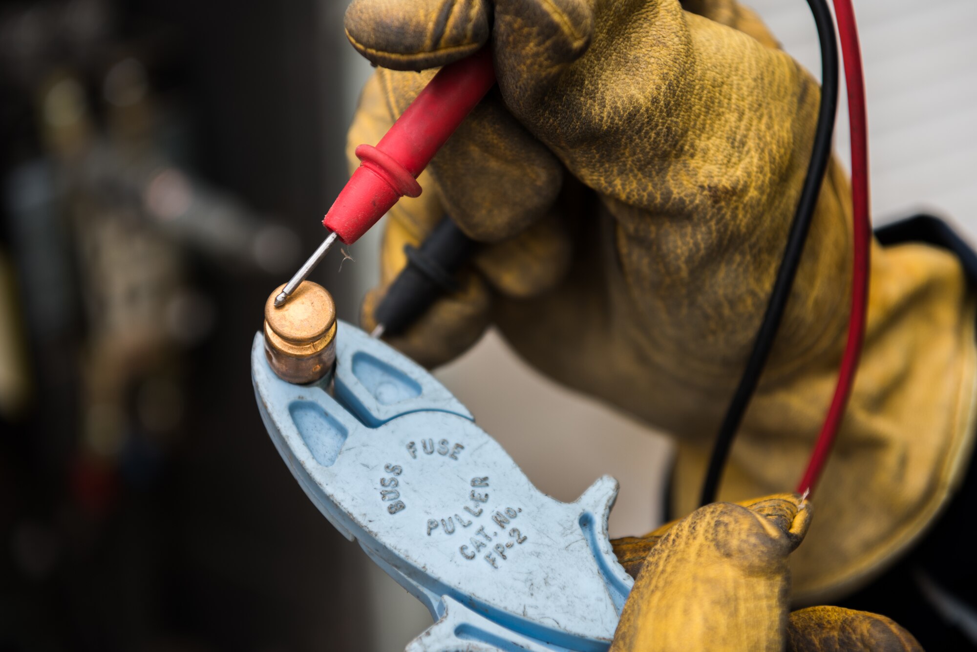 Airmen at the 9th Civil Engineer Squadron heating, ventilation and air conditioning technicians use gear such as multi-meters and arc flash clothing to work on HVAC systems at Beale Air Force Base, California, Aug. 2, 2018. A multi-meter tool measures electrical values such as voltage by using positive and negative test leads. (U.S. photo by/Senior Airman Justin Parsons)