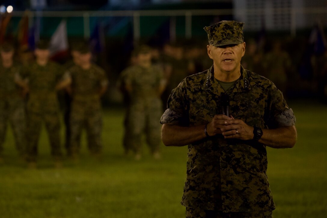 Commandant of the Marine Corps Gen. Robert B. Neller gives remarks during the III MEF change of command ceremony Aug 2, 2018, at Camp Courtney, Okinawa, Japan.  During the ceremony, Nicholson relinquished command of III MEF to Lt. Gen. Eric M. Smith. (U.S. Marine Corps Photo by Lance Cpl. Harrison Rakhshani)