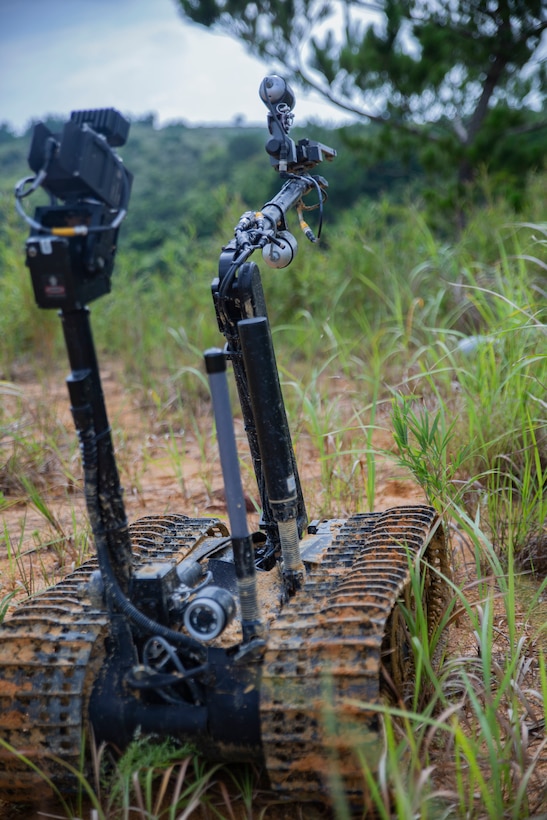 Marines with Explosive Ordnance Disposal Company, 9th Engineer Support Battalion, 3rd Marine Logistics Group, use the Mark II Talon EOD robot during charge employment training Aug. 2, 2018 at Camp Hansen, Okinawa, Japan. The robot is an unmanned device controlled by EOD technicians, used to remove improvised explosive devices in any terrain or environment. (U.S. Marine Corps photo by Pfc. Terry Wong