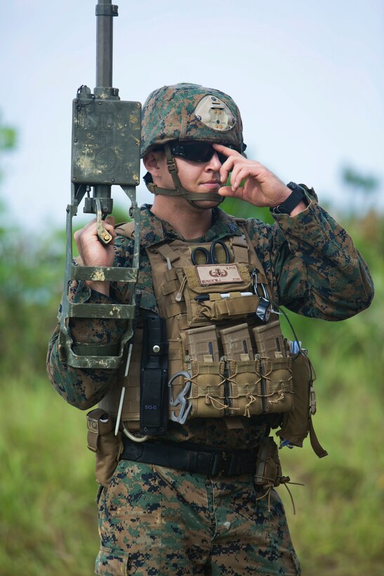 Sgt. Maximilian Musick uses a metal detector to find improvised explosive devices in his path during charge employment training Aug. 2, 2018 at Camp Hansen, Okinawa, Japan. The training taught explosive ordnance disposal technicians to effectively neutralize IED threats with unmanned robotic platforms by safely finding and removing any hazards. Musick, a native of Phoenix, Arizona, is an EOD technician with EOD Company, 9th Engineer Support Battalion, 3rd Marine Logistics Group. (U.S. Marine Corps photo by Lance Cpl. Isabella Ortega)