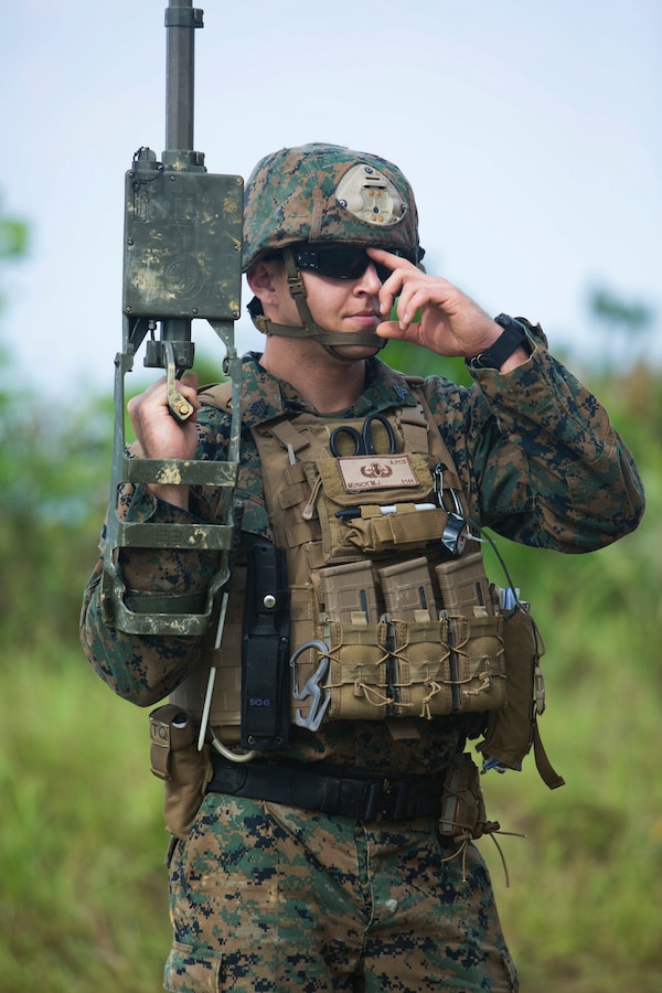 Sgt. Maximilian Musick uses a metal detector to find improvised explosive devices in his path during charge employment training Aug. 2, 2018 at Camp Hansen, Okinawa, Japan. The training taught explosive ordnance disposal technicians to effectively neutralize IED threats with unmanned robotic platforms by safely finding and removing any hazards. Musick, a native of Phoenix, Arizona, is an EOD technician with EOD Company, 9th Engineer Support Battalion, 3rd Marine Logistics Group. (U.S. Marine Corps photo by Lance Cpl. Isabella Ortega)